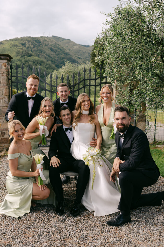 candid portrait of wedding party at casale de pasquinelli wedding venue in tuscany italy