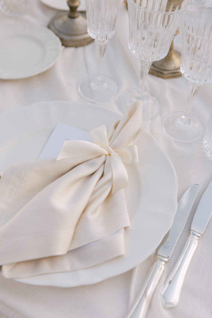 table styled with soft fabrics in neutral tones for wedding reception 