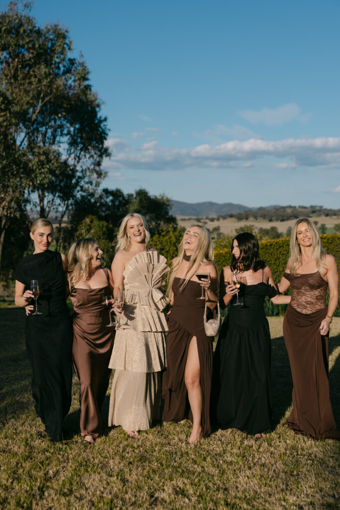 candid shot of wedding guests in brown coloured dress code 