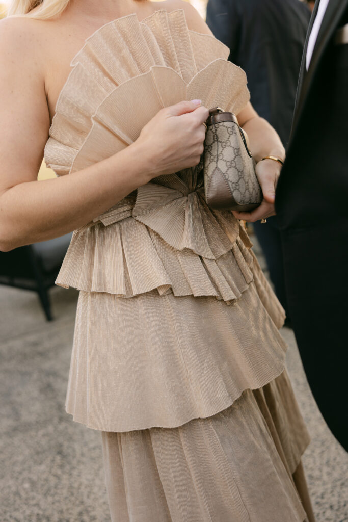 high fashion editorial shot of wedding guest in brown themed dress code