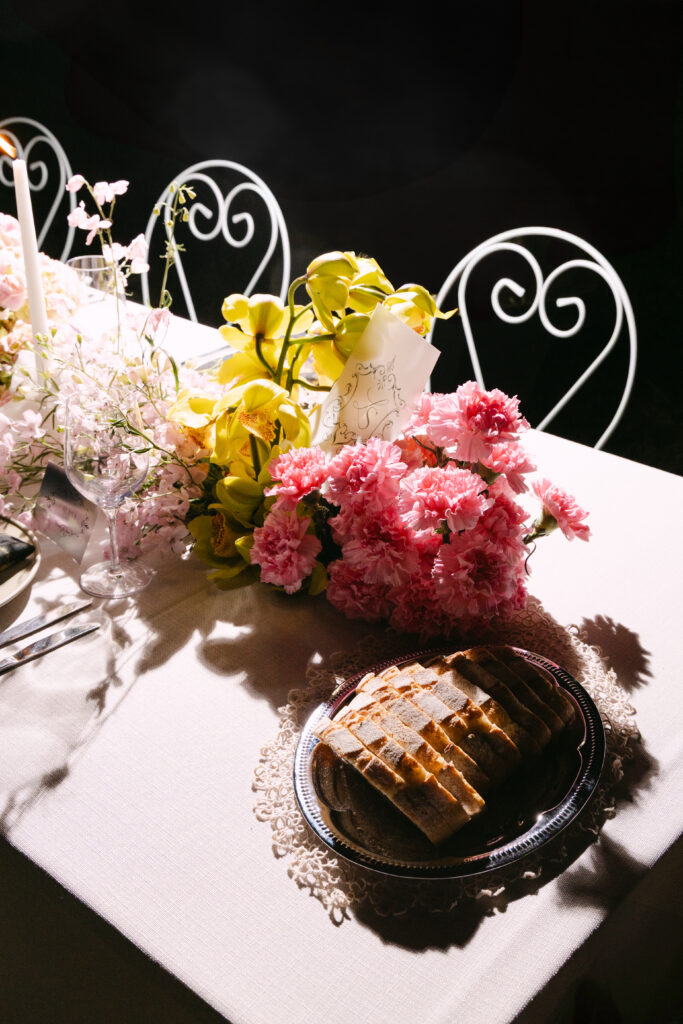 editorial shot of florals and table styling for wedding reception at the merribee