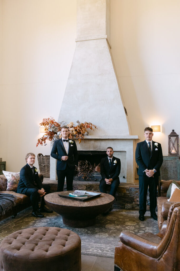 editorial portrait of groom with groomsmen before the wedding ceremony at stones of the yarra valley