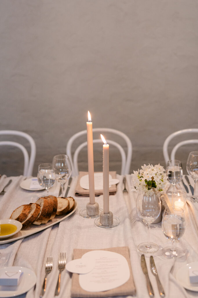 wedding reception table styling with cathedral candles at stones of the yarra valley