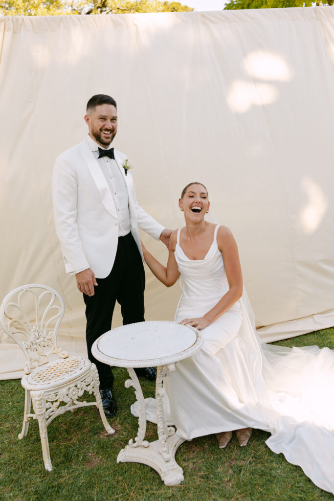 candid portrait of bride and groom relaxing after wedding ceremony at woolbrook homestead